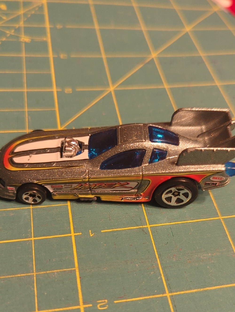 2010 Hot Wheels HLADEK Silver Racing Toy Car with Blue Windows and Red Accents
